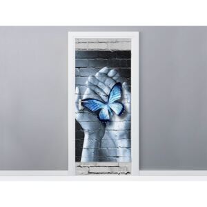 Gario Samolepící fólie na dveře Modrý motýl na dlaních 95x205cm