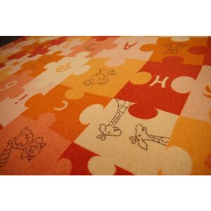 Dětský metrážový koberec Puzzle oranžový